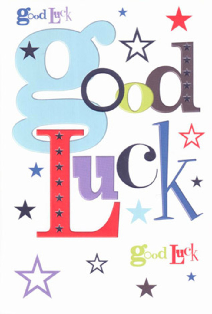 In this photograph, a modern good luck card fills the frame, its design echoing the atmosphere of a small celebration, like the buzz at a Noak Hill doorstep when flowers and well wishes arrive together. At the heart of the card, the words "Good Luck" aren't written as a single, neat line; instead, the letters tumble and overlap slightly, each one boasting its own personality. A wide, pastel-blue "g" curves confidently across the left, balanced by upright letters in strong cherry reds, leafy greens, solid blacks, and plush purples, every font style different-some thick and rounded, others narrow and refined-creating a sense of movement and friendly chatter. All of this sits on a pure white background that feels as crisp as fresh card stock on our workbench, giving the colours a chance to glow rather than shout. All around the phrase, dozens of tiny stars sparkle in a loose galaxy, drifting above, below, and between the letters. The stars range from deep navy and midnight indigo to softer tones of sky blue, lavender, and pale lime, with some sharp and vivid while others appear almost faded, like distant constellations you might glimpse above the trees near Noak Hill's open green spaces. The printing looks smooth and flat, yet there's an implied tactile pleasure, as if you could trace each letter and star with a fingertip, feeling the cool surface of quality card beneath. No flowers appear on the card, but its playful composition calls to mind a mixed, brightly coloured bouquet chosen to mark an exam result, a driving test, or a new job in nearby Collier Row-an upbeat, heartfelt send-off distilled into paper, ink, and starlit optimism.